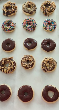 large baking sheet with different varieties of donuts