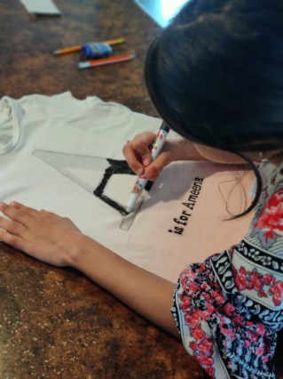 Design t-shirts using a template or a stencil printed out from the internet