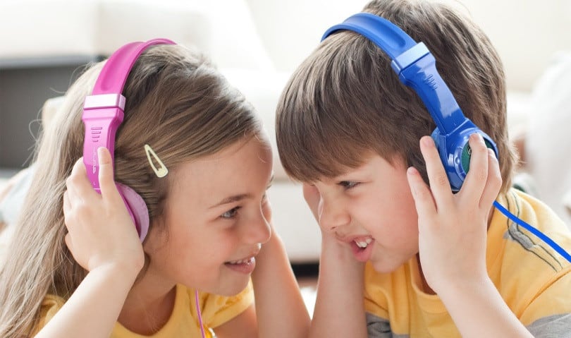 kids listening to podcasts through earphones