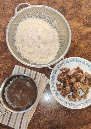 Rice, stock and meat for the Pakistani pilau rice dish