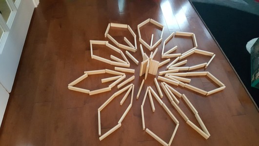 Building activities are the best creative activities for kid. This flower was made using Keva planks.