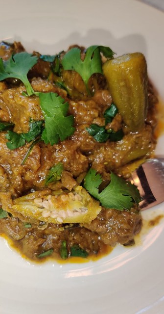 meat and okra curry on a plate