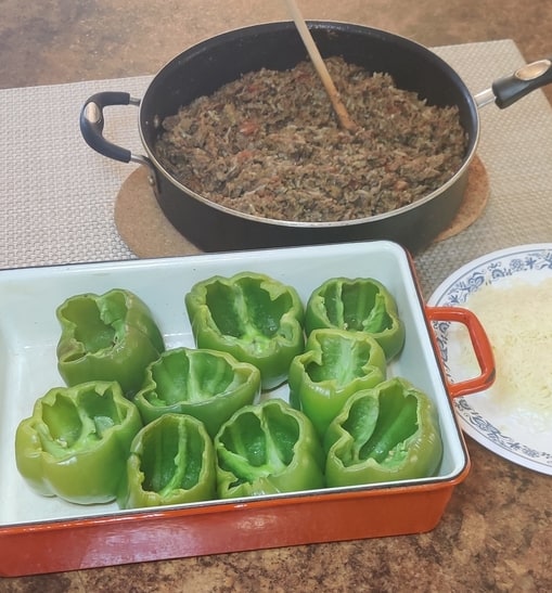 bell peppers in a baking dish and ground beef