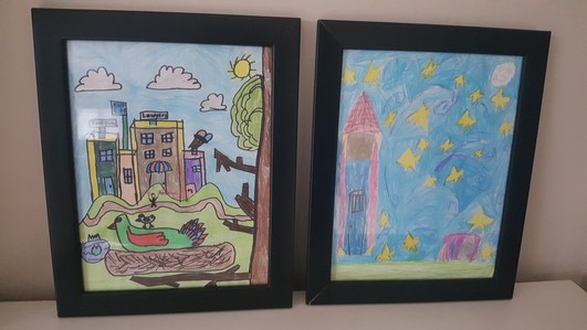kids' artwork framed and ready to be hung up
