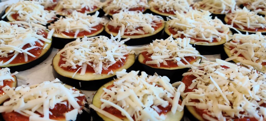 eggplant slices with sauce and cheese on top