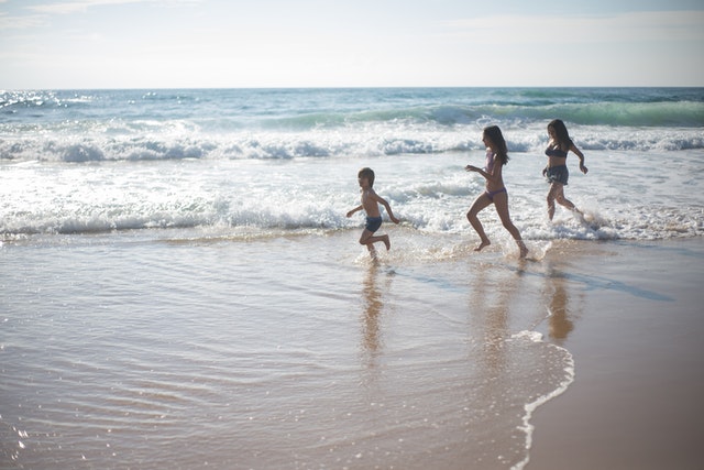 kids playing on the beach