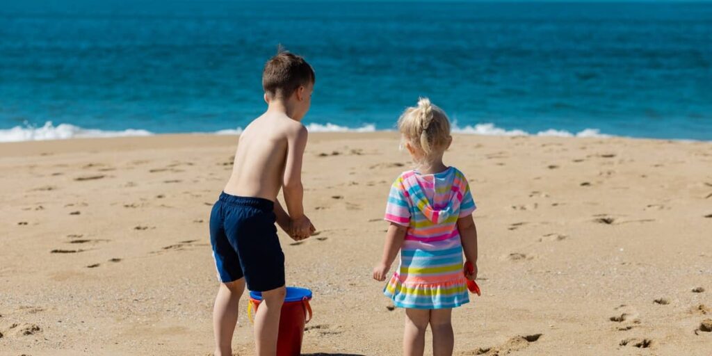 two kids on a beach