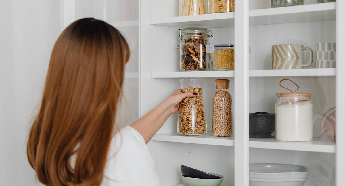 woman organizing shelves, pantry
