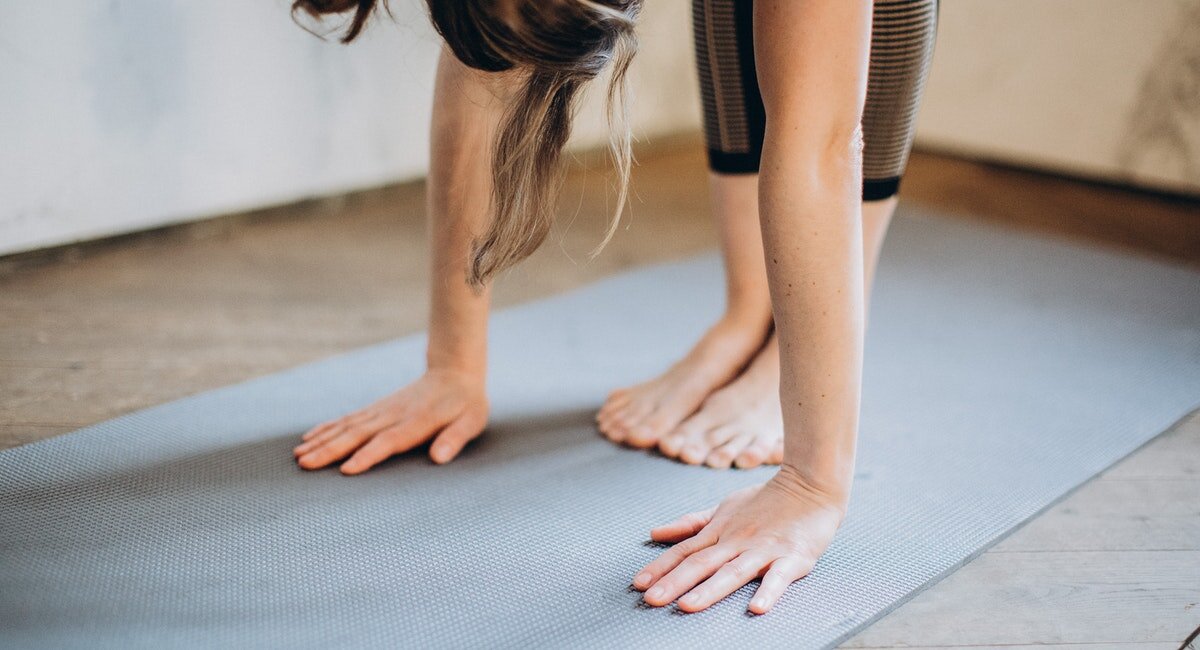 girls stretching on a yoga mat