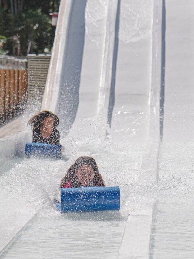 indoor water parks in the U.S., kids going down a water slide pexels-denniz-futalan-3453009