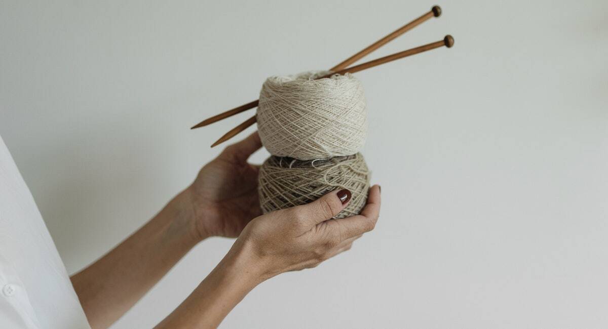 yarn and knitting needles for the article 50 hobbies for better health and happier life