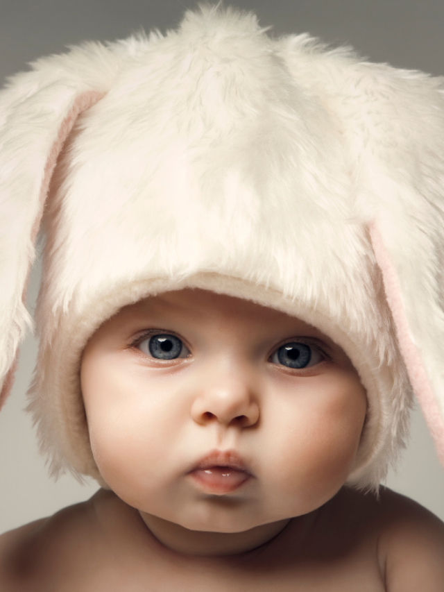 baby wearing a fluffy white bunny hat