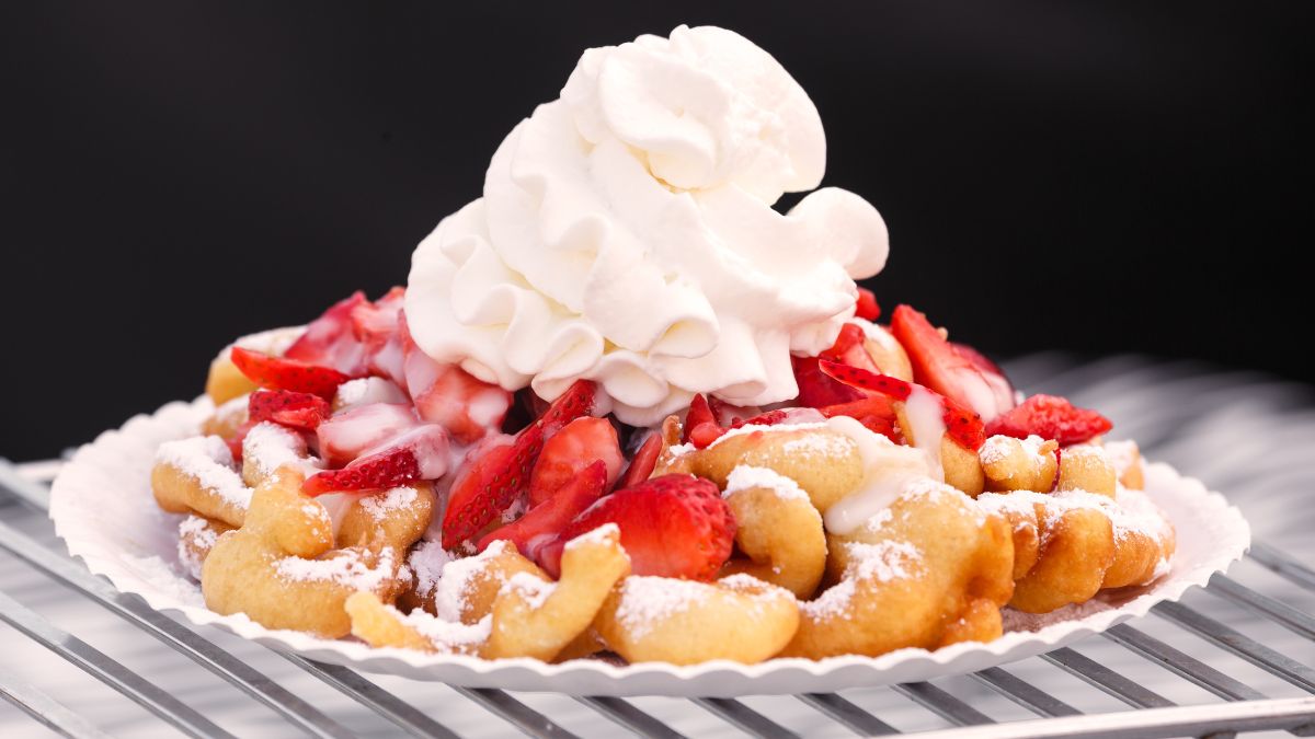 funnel cake with whip cream on top