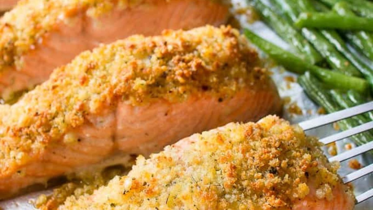 Crusted salmon and vegetables on a sheet pan.