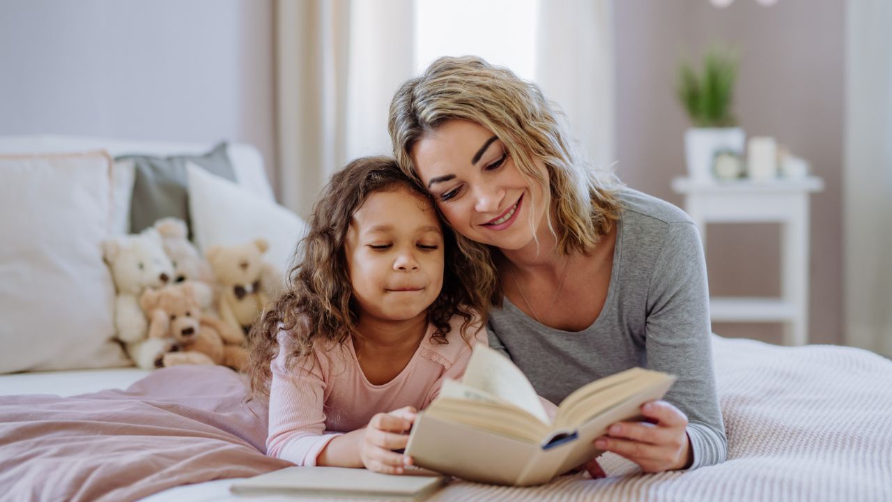 mother and daughter reading a bedtime story
