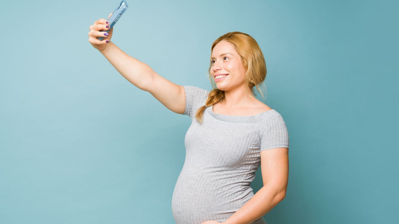 pregnant woman taking a selfie