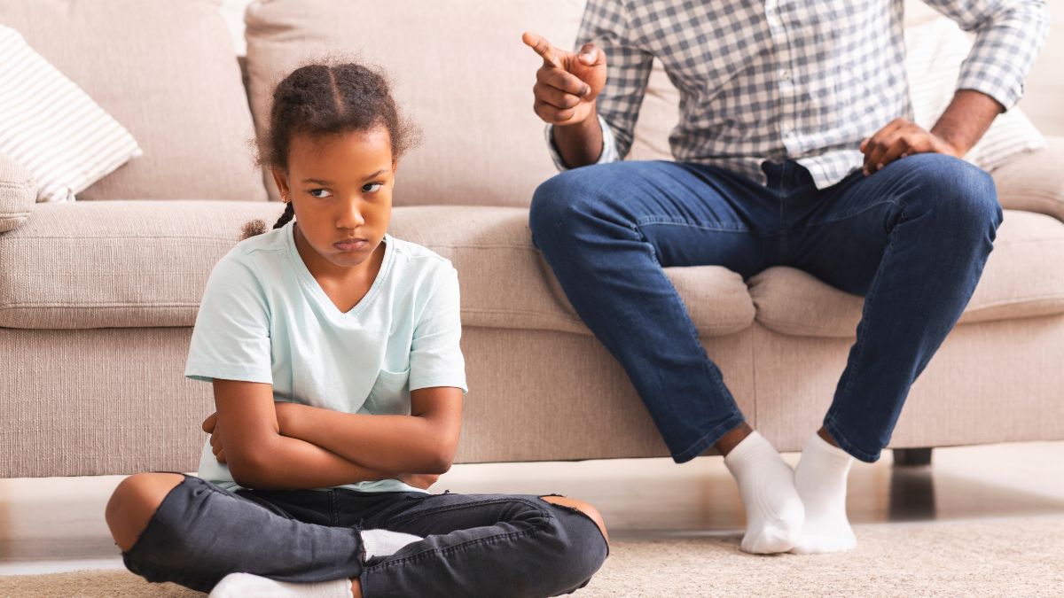 girl is unhappy and getting disciplined by her parent