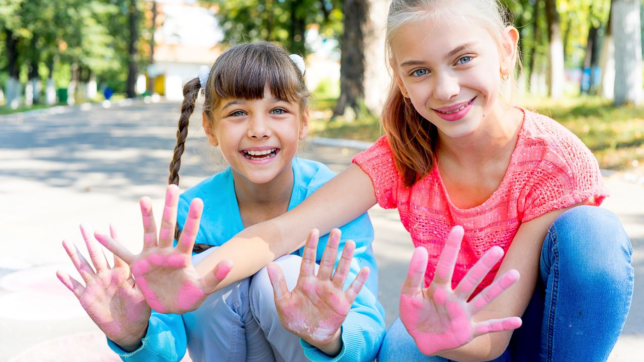 girls with chalk handprints
