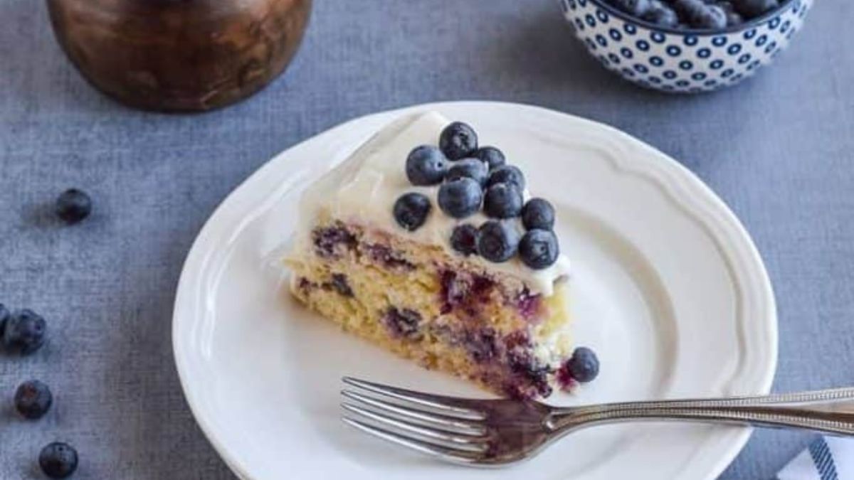 a slice of gluten free lemon blueberry cake on a plate