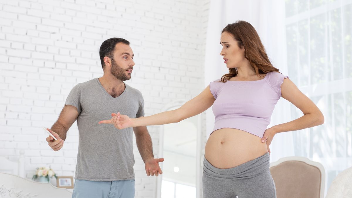 pregnant woman arguing with man