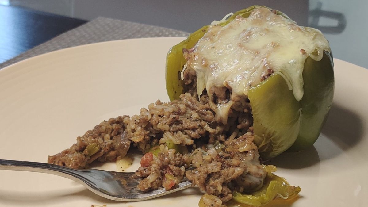 stuffed pepper with ground beef coming out with fork