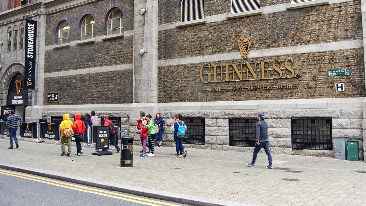 view of Guinness storefront with people walking in front