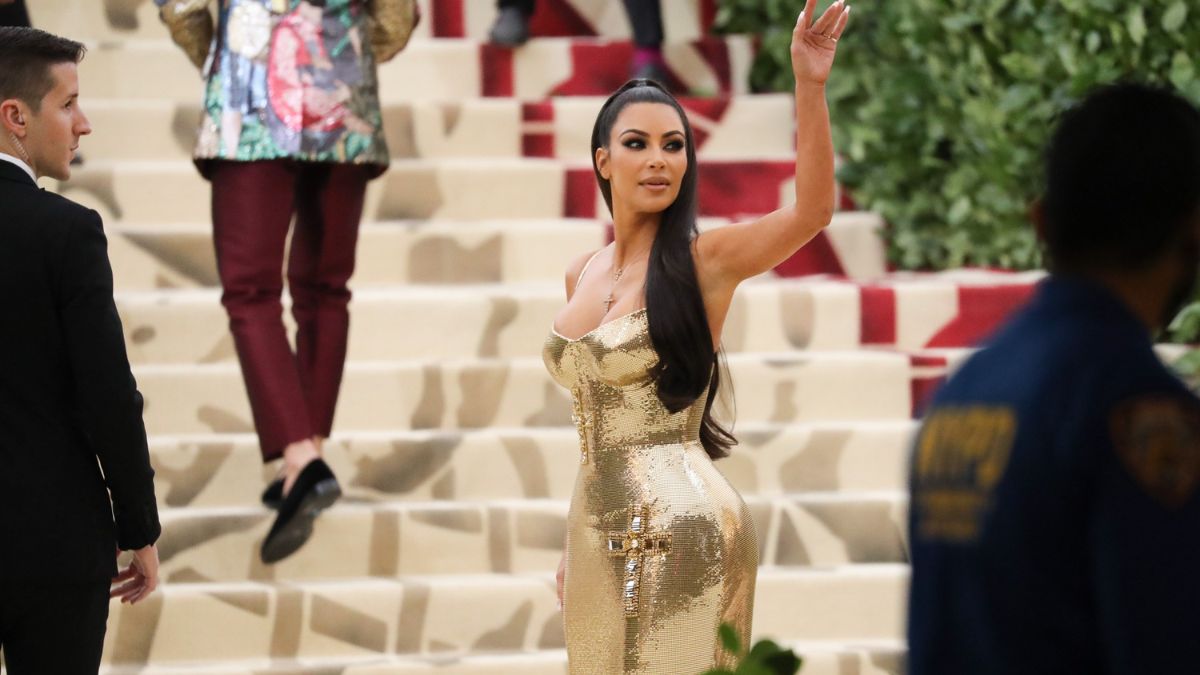 Kim Kardashian in a gold gown.