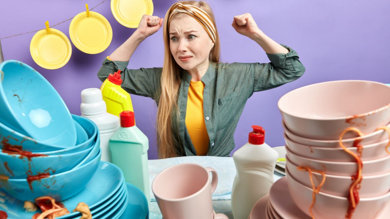 woman angry seeing a big pile of dishes