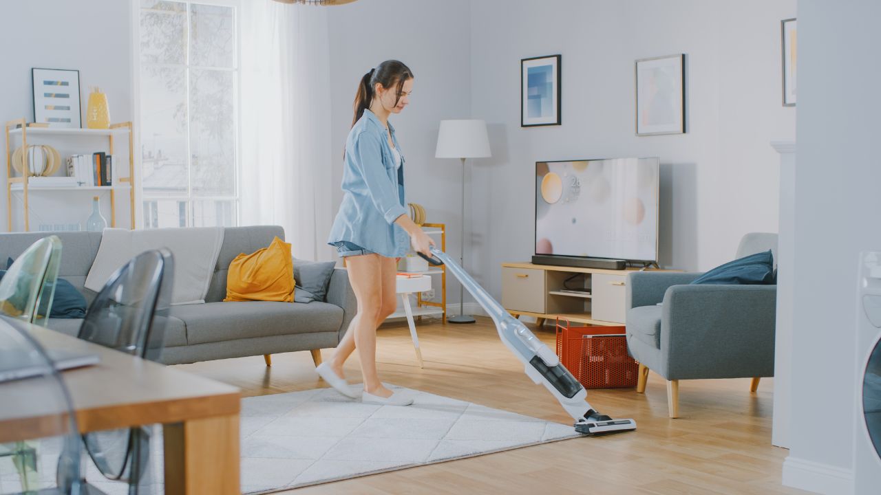 woman using a cordless vacuum