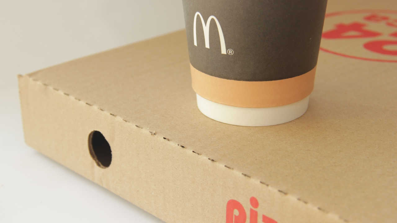 McDonald's coffee cup on a pizza box