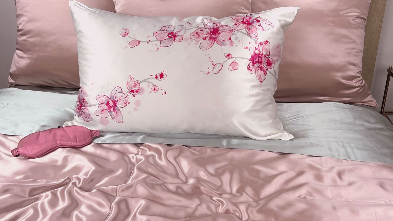 pink silk pillowcase on a bed