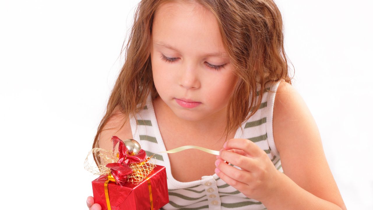 girl opening a gift
