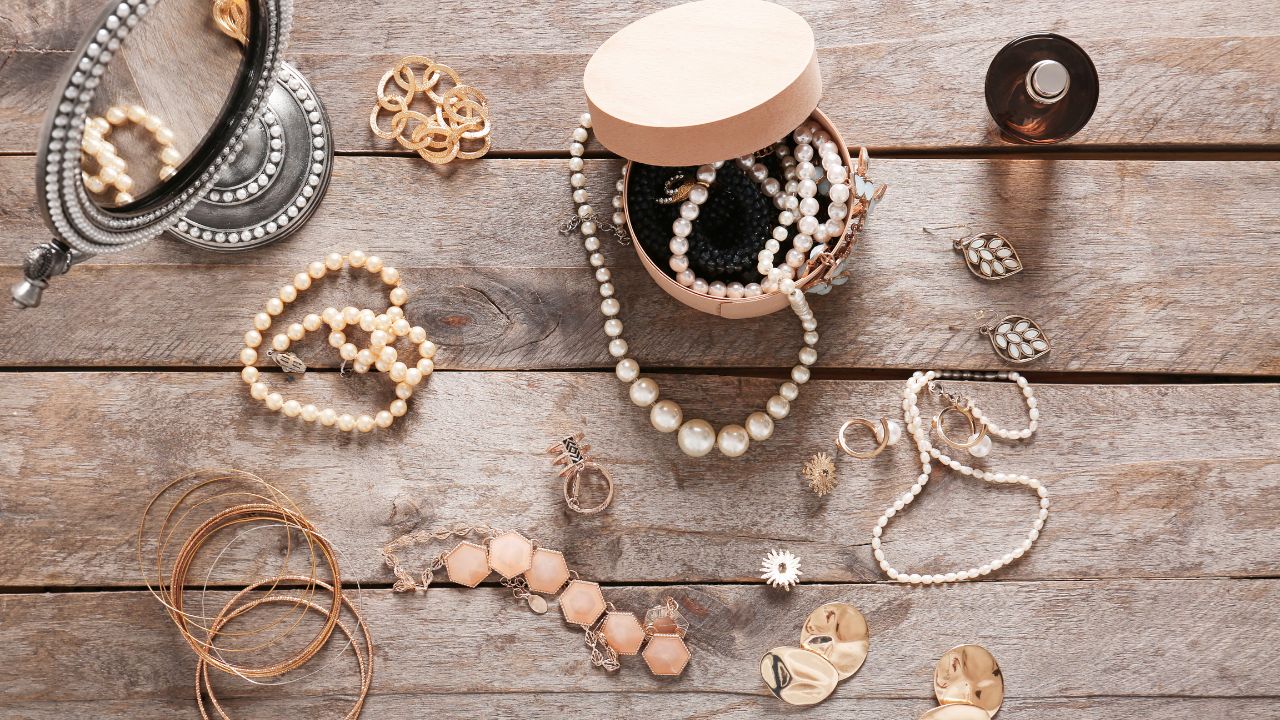 jewelry in a box and on a wooden table