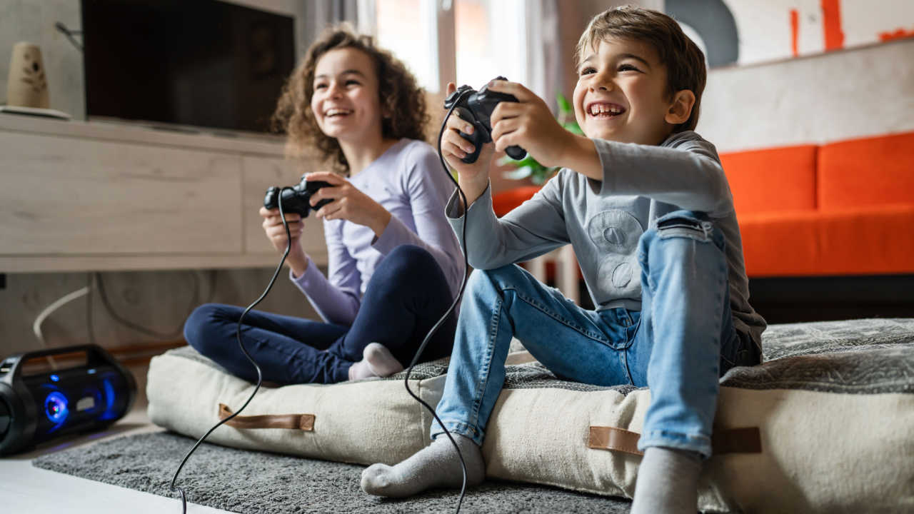 a boy and a girl playing video games