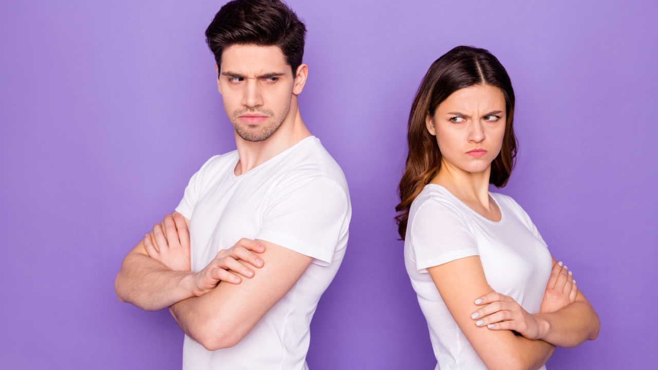 man and woman back to back angry with each other