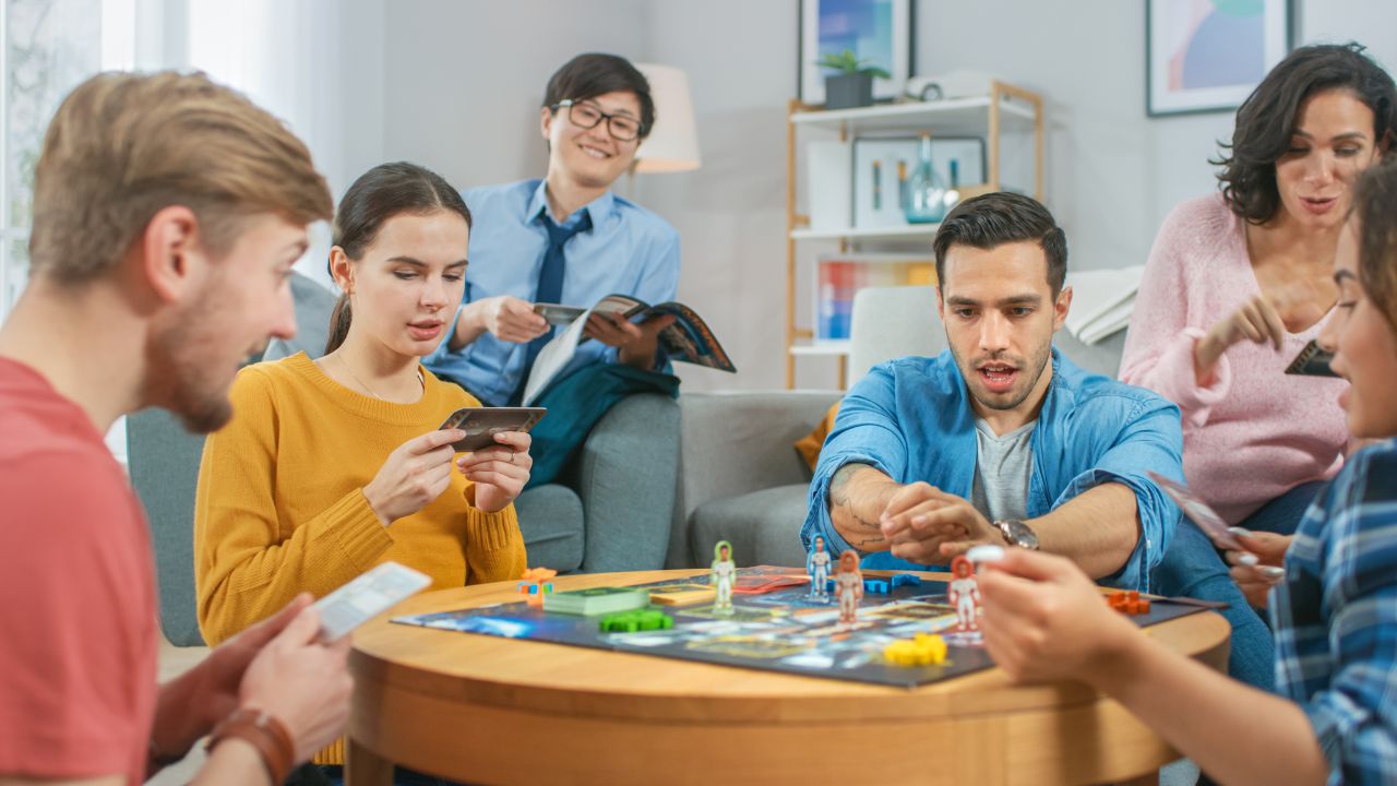 people playing a board game