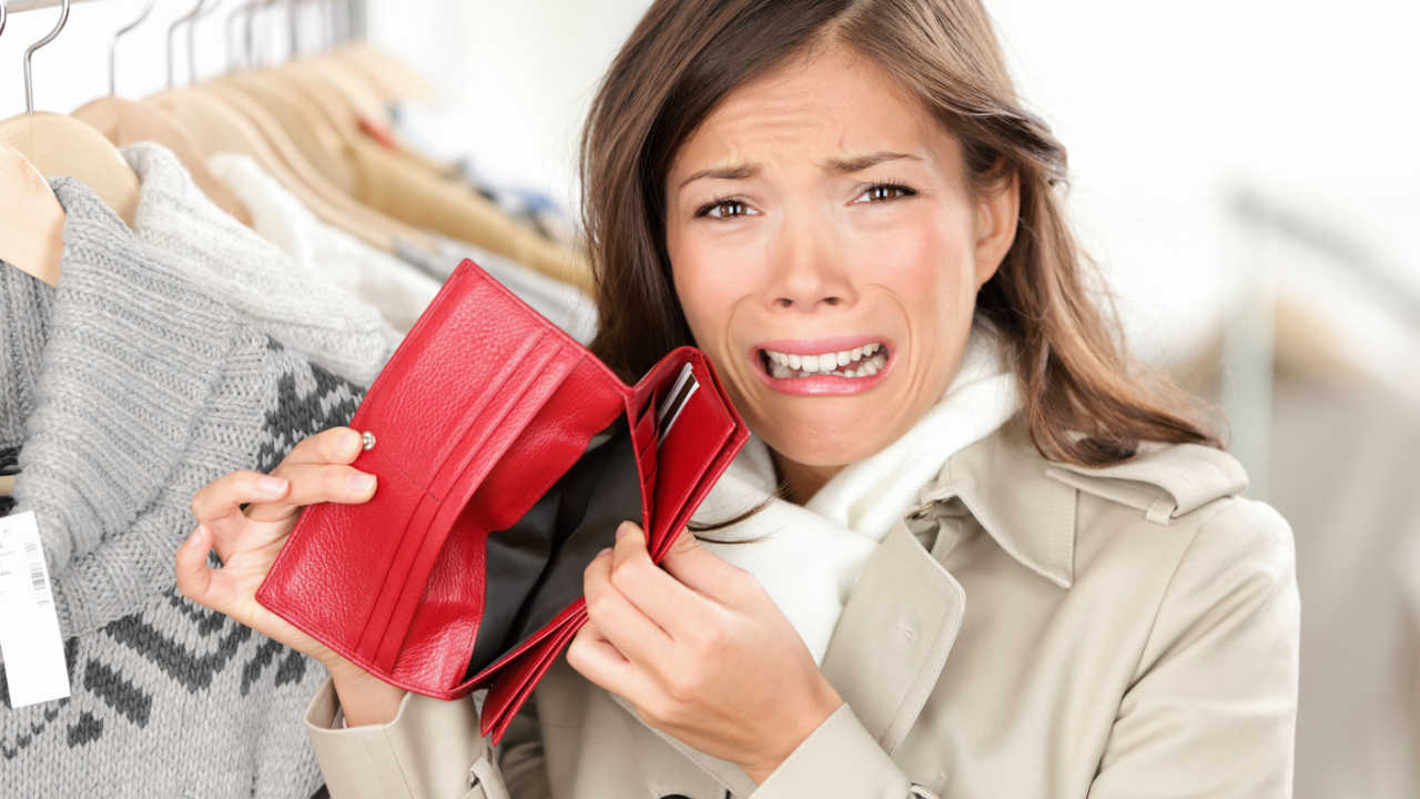 woman upset she doesn't have any money in her wallet