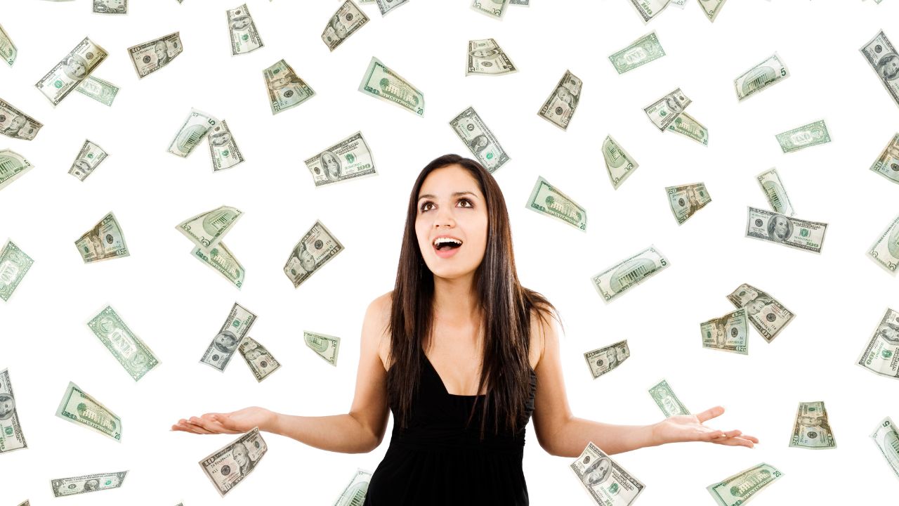 woman surrounded by money in the air