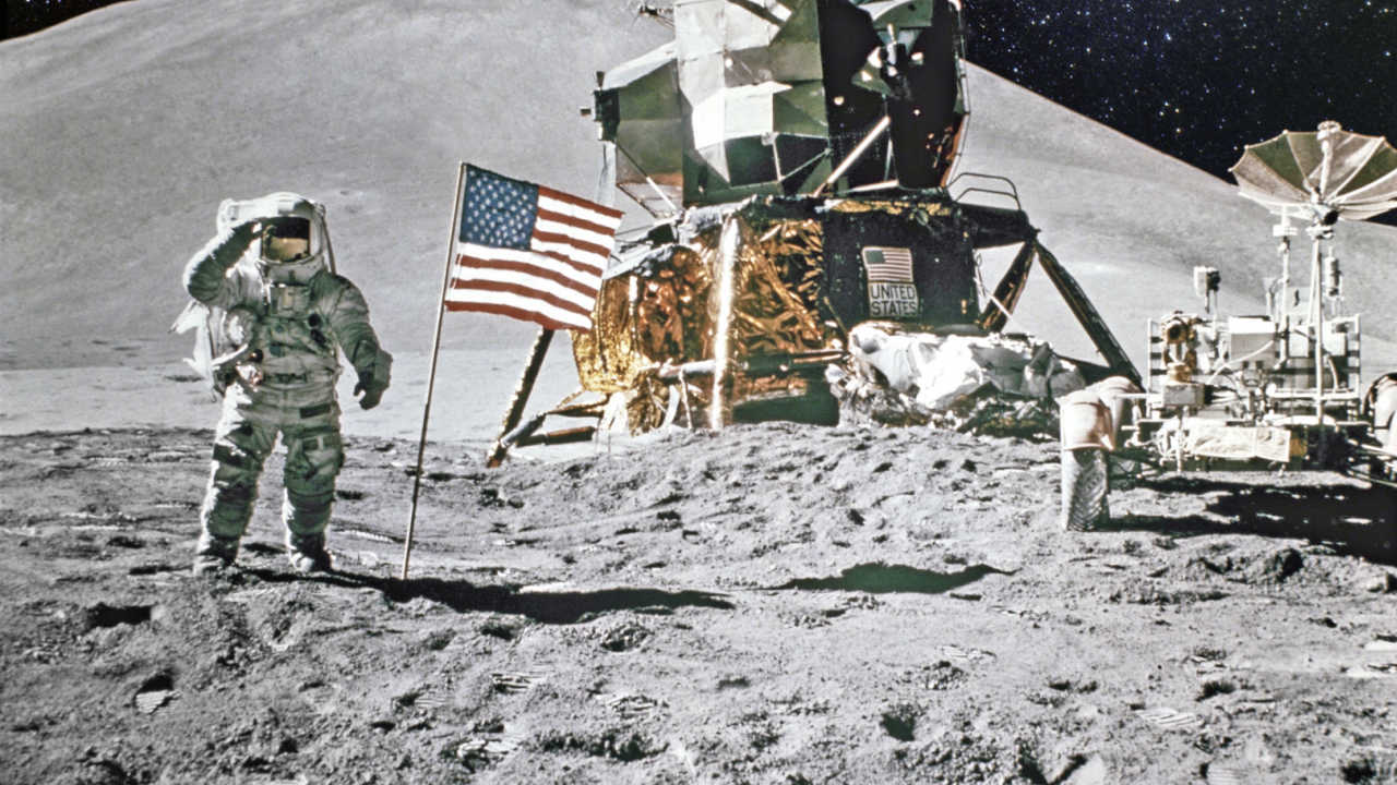 American flag and astronauts on the moon