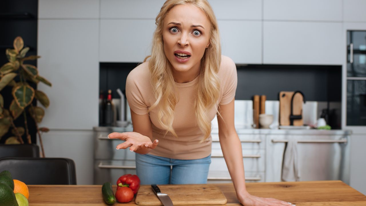 woman in the kitchen looking angry
