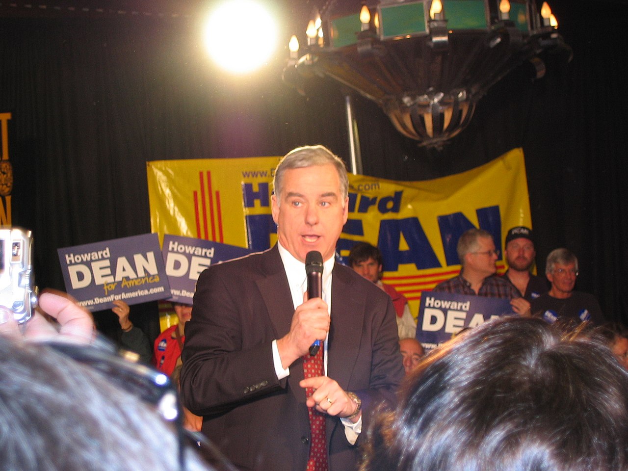 Howard Dean holding mic and talking at a rally