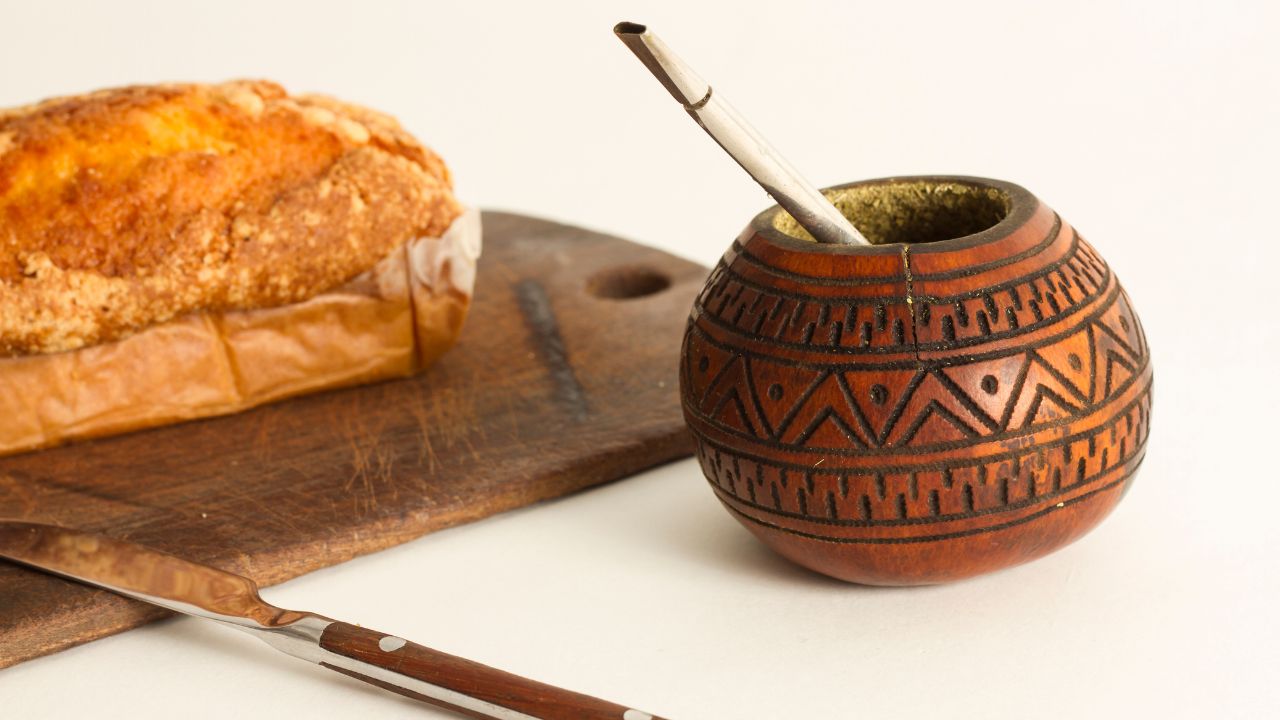 Yerba Mate beside a cutting board and bread