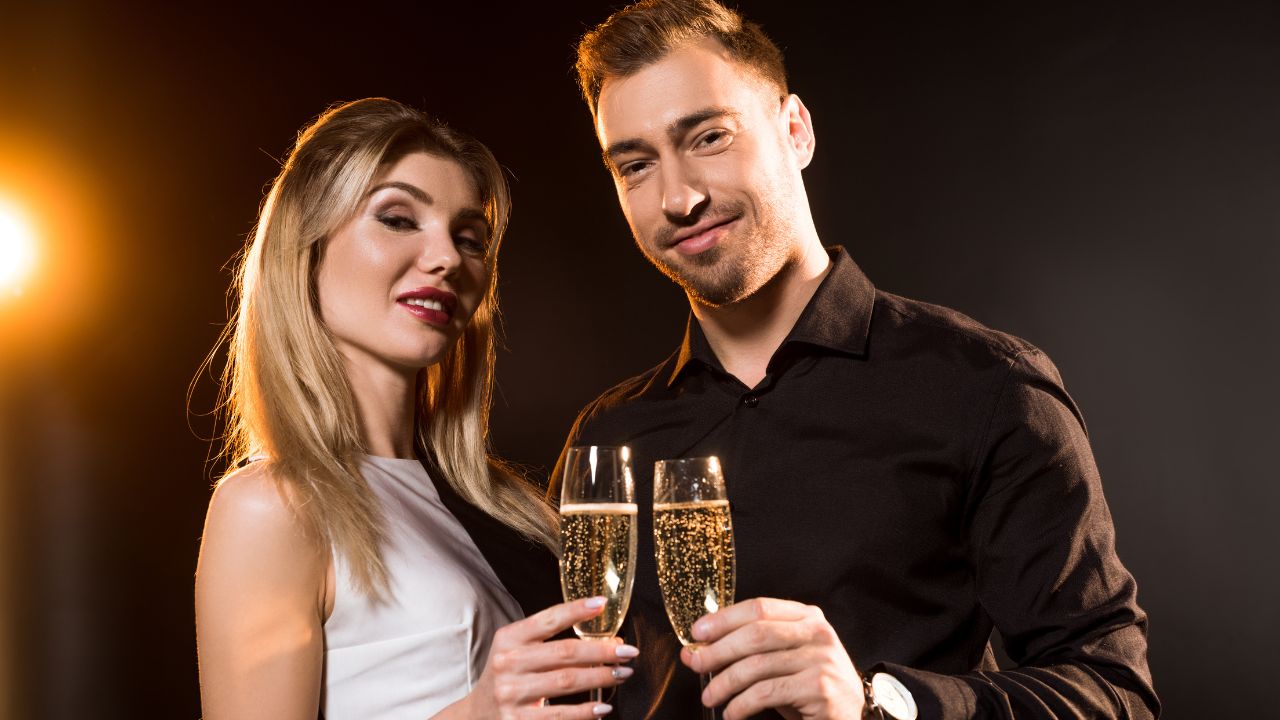 man and woman drinking wine in glasses