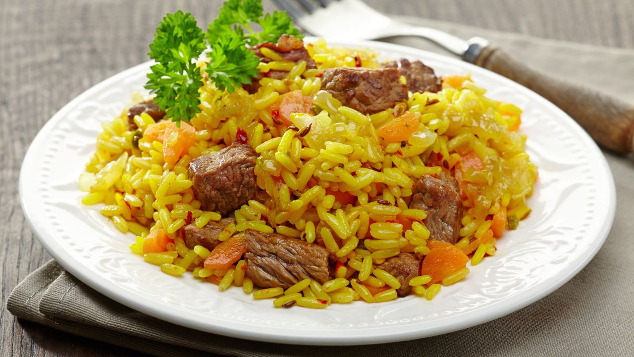 rice dish with beef on a plate