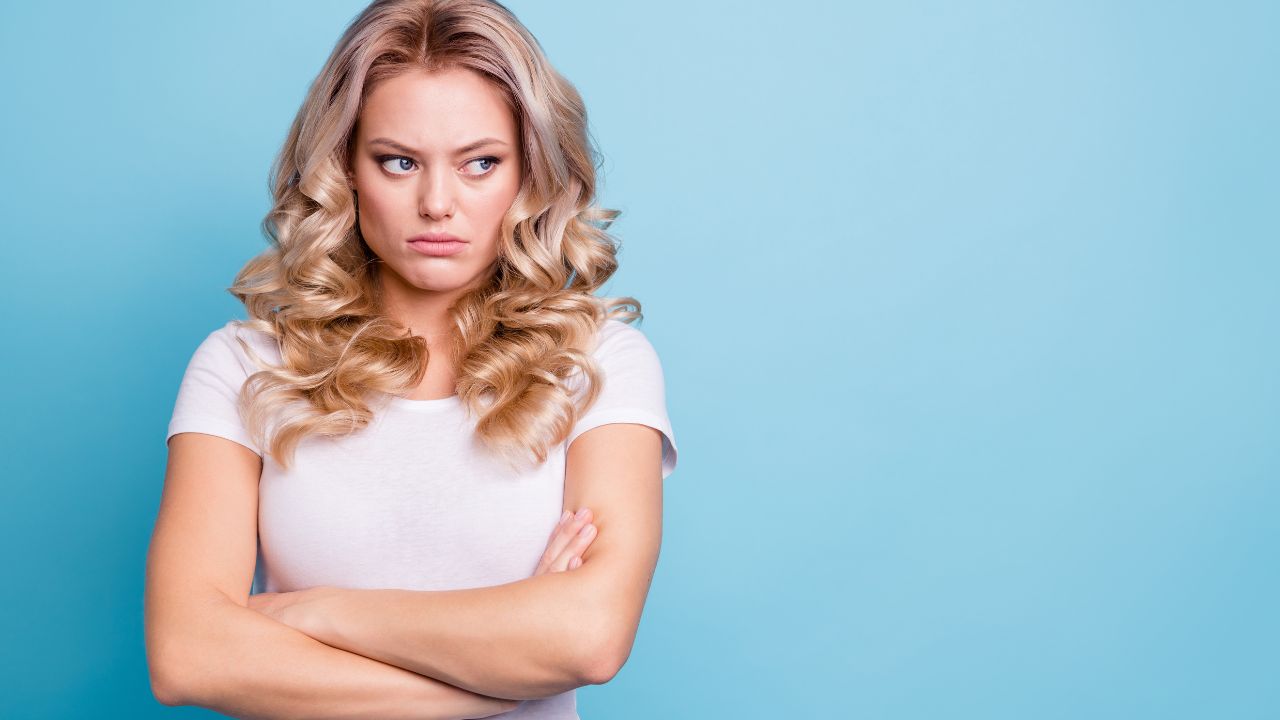 woman looking angry with arms crossed