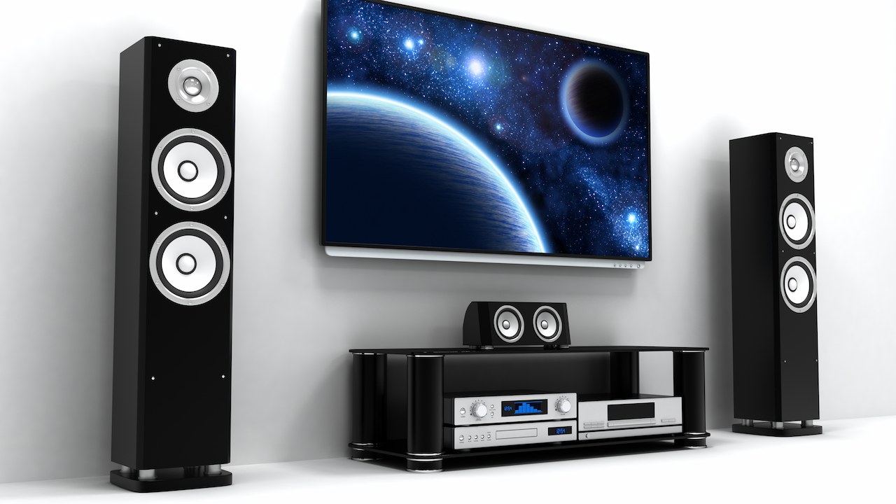 entertainment system, tv and two speakers