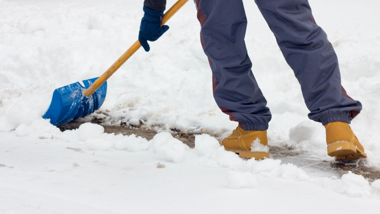 person shovelling the snow