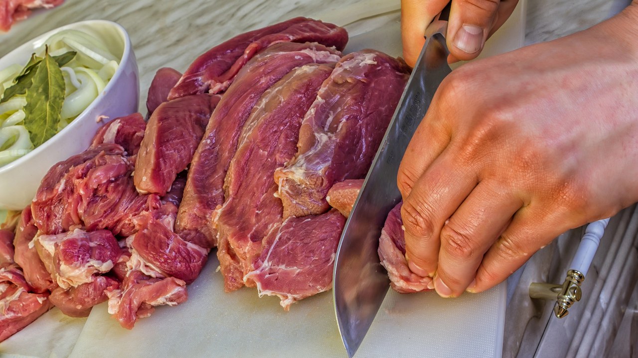 Cutting raw meat