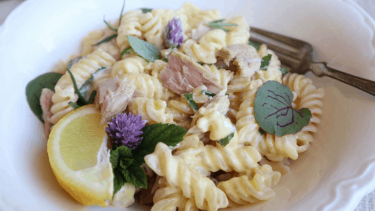 fusili alfredo with tuna in a bowl